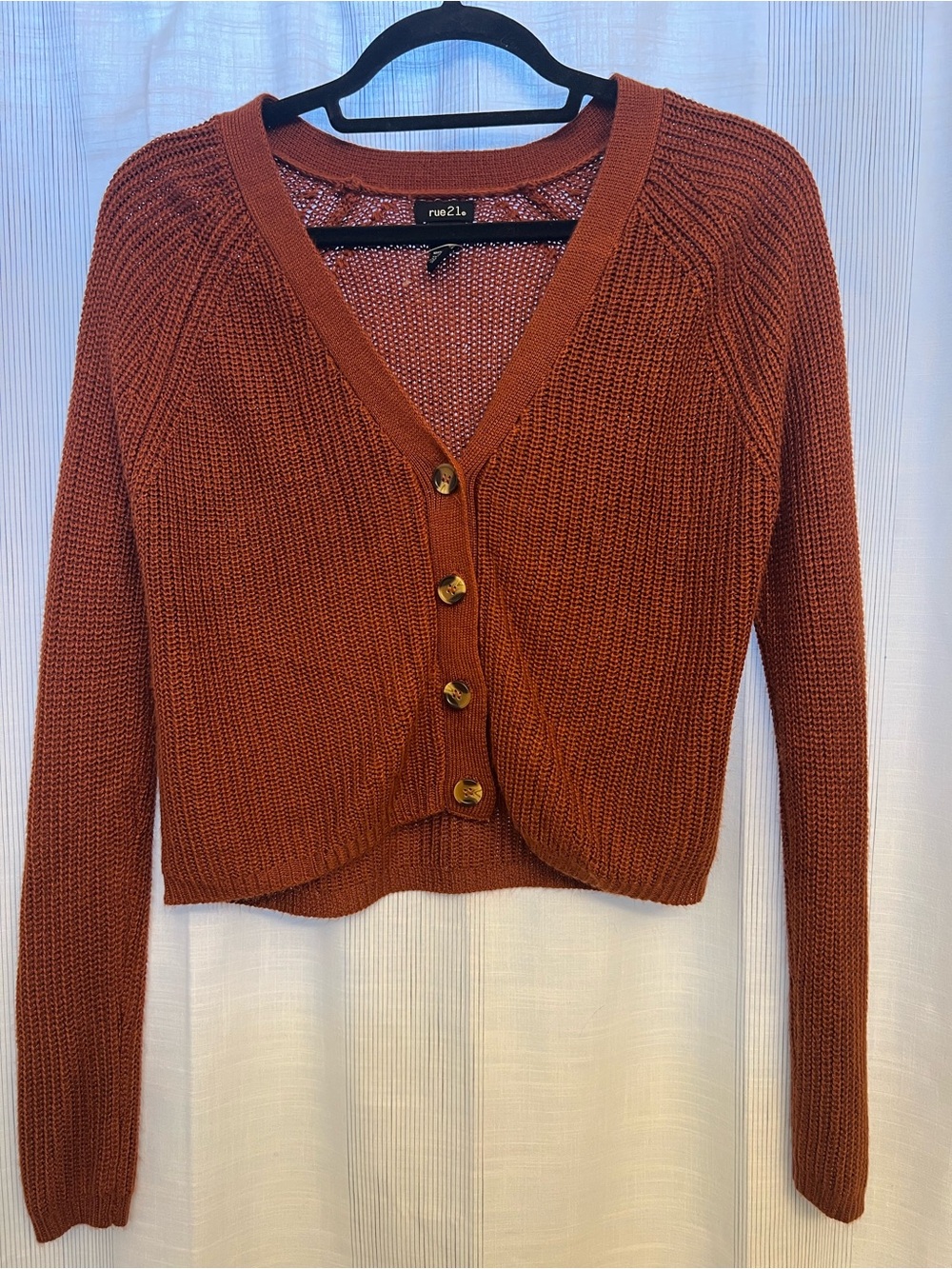 Lovely burnt-orange/brown button-up sweater, perfect for the approaching autumn!